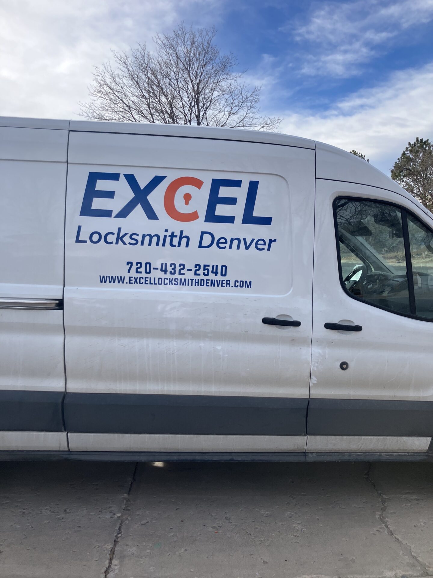 Excel Locksmith Denver commercial service van with company logo